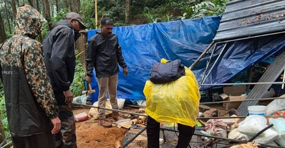 Forest officials demolish an illegally constructed shed built on encroached forest land. Photo: Special Arrangement
