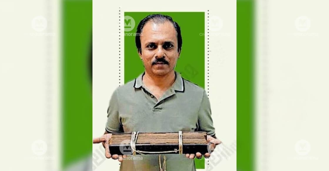 P Abdul Saleem, popularly known as Saleem Padavanna, with the 350 year old palm leaf manuscript of Adhyatma Ramayanam Kilippattu. Photo: Special Arrangement