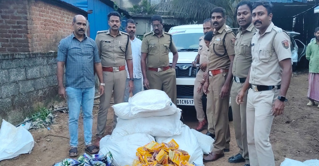 Excise officials with the banned intoxicants. Photo: Special Arrangement