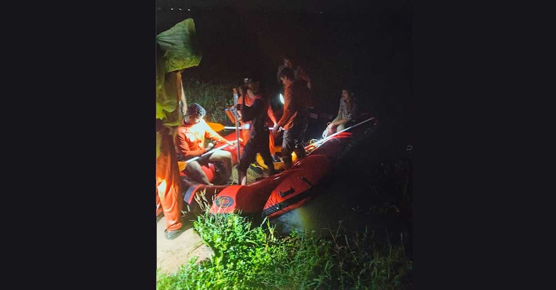Rescue operations underway at a waterlogged paddy field at Nedupuzha in Thrissur after a boat capsizes. Photo: Special arrangement 