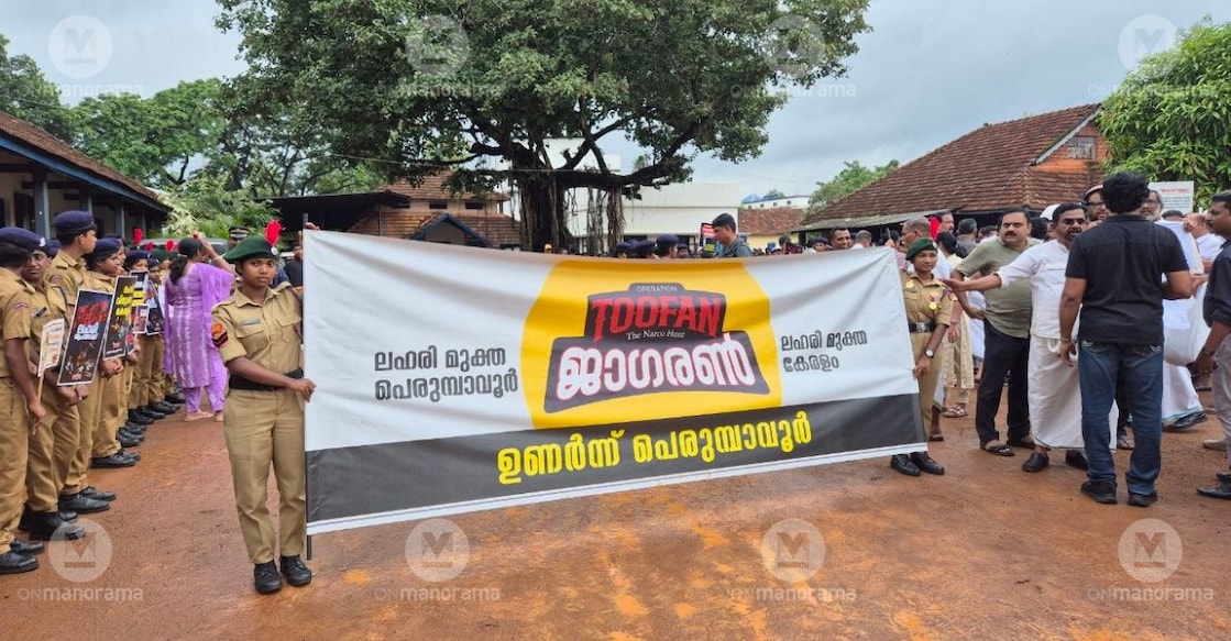 Children holding a banner of Operation Toofan