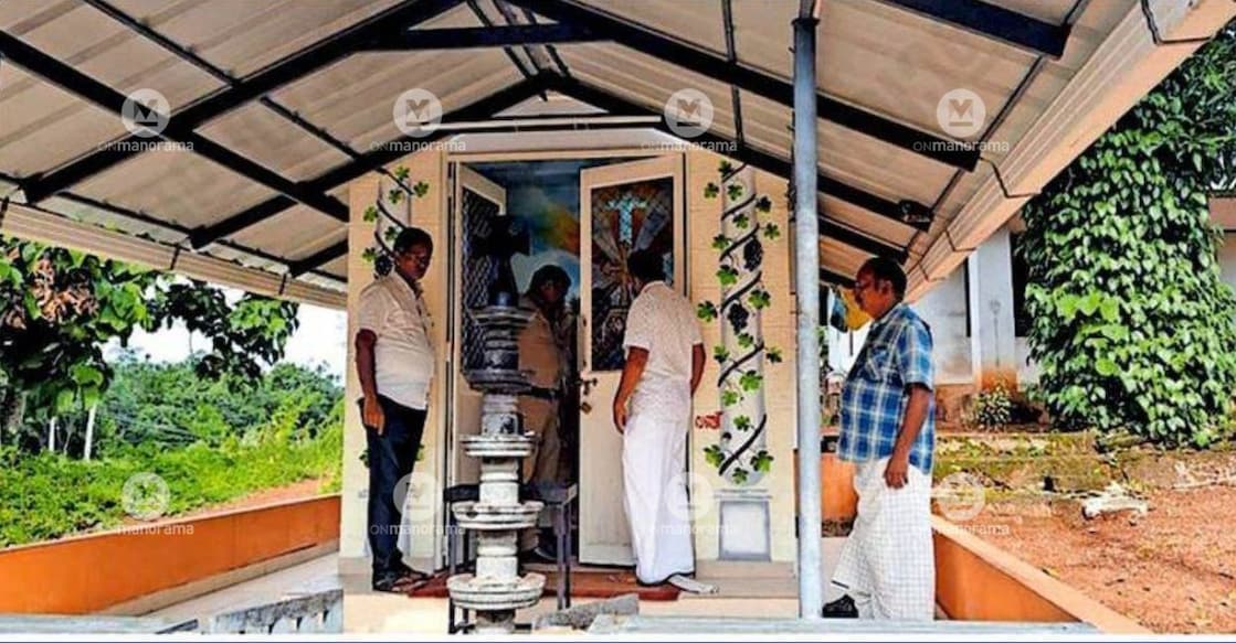 Police inspect the Plamoodu roadside shrine of the St. George Jacobite Syrian Church at Nallila, where burglars broke open the offering box and stole cash. Photo: Special Arrangement.
