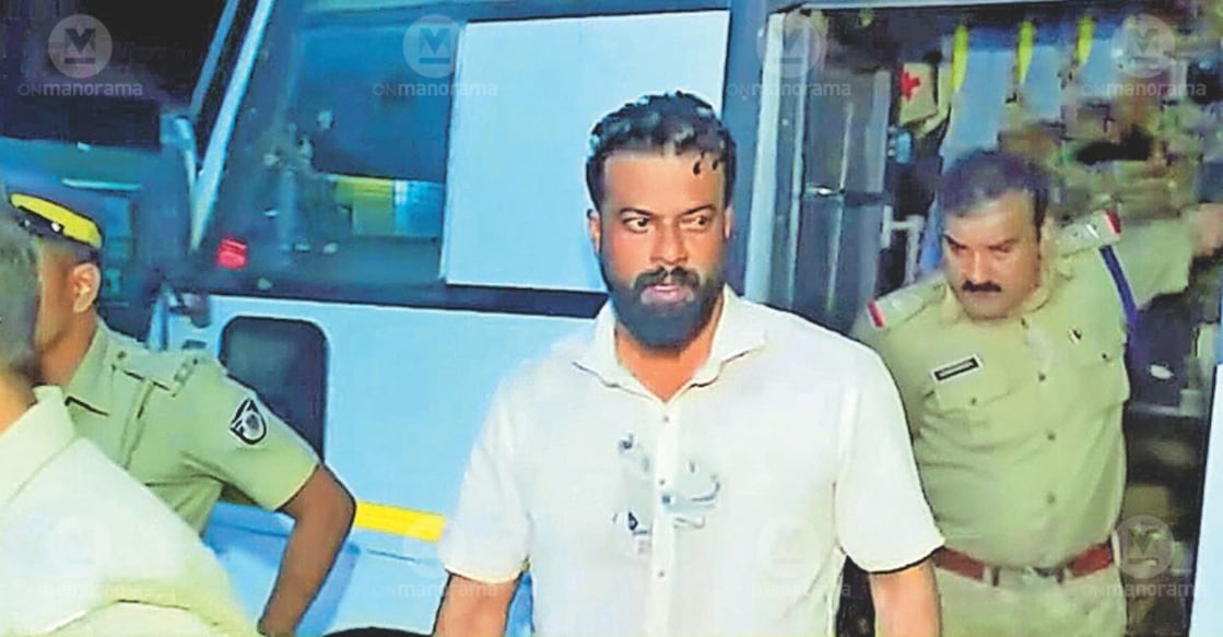 Police taking Sugathan into custody. File Photo: Special Arrangement. 