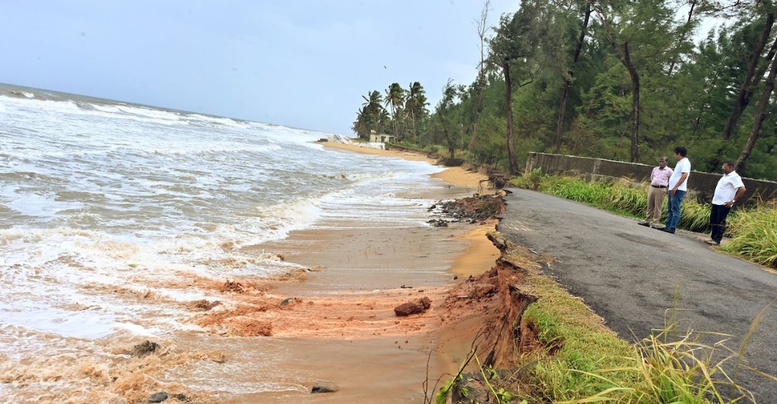 A stretch of road in front of the ICAR-Central Plantation Crops Research Institute's beach experimental block in Kasaragod was washed away by rough seas. Photo: Special Arrangement. 