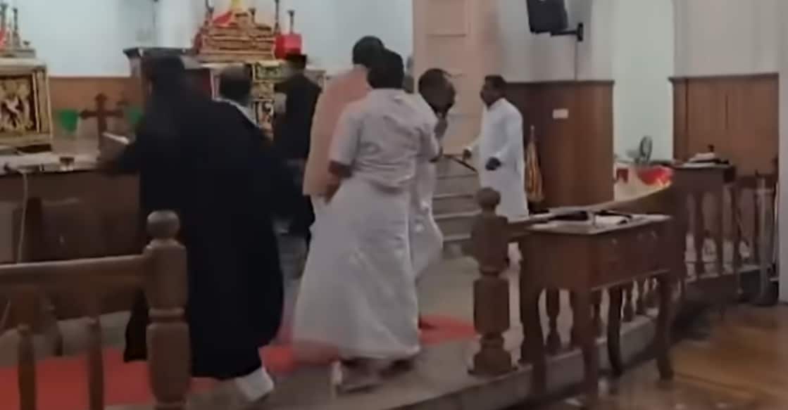 A screengrab showing priests and parishioners clashing inside St John’s Bethlehem Church at Piramadam. Photo: Manorama News