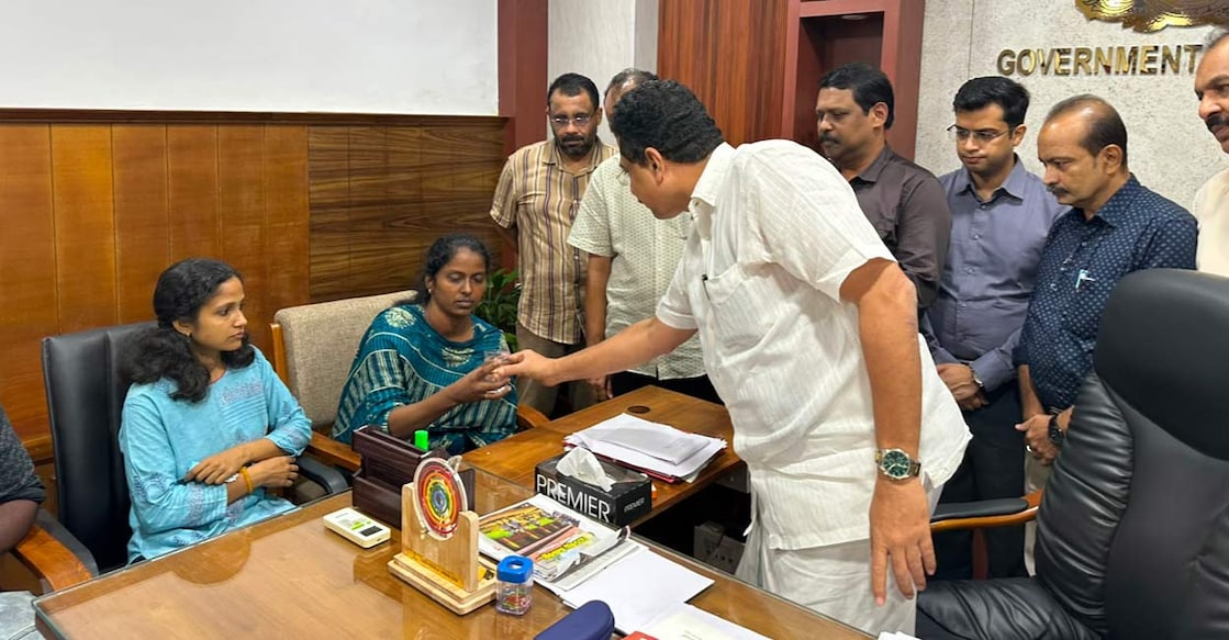 S Valarmathi (second from left) with the Minister. Photo: Manorama
