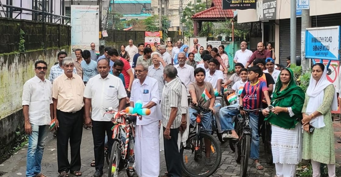 Prakashan with the bicycle gifted to him, joined by his friends and local residents. Photo: Special Arrangement