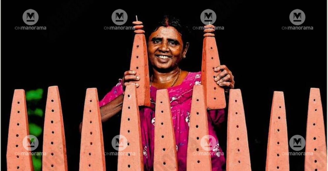N Lakshmi of Kannanoorpadam in Pallassana with the clay Mathors she made for the Onam season. Photo: Special Arrangement.