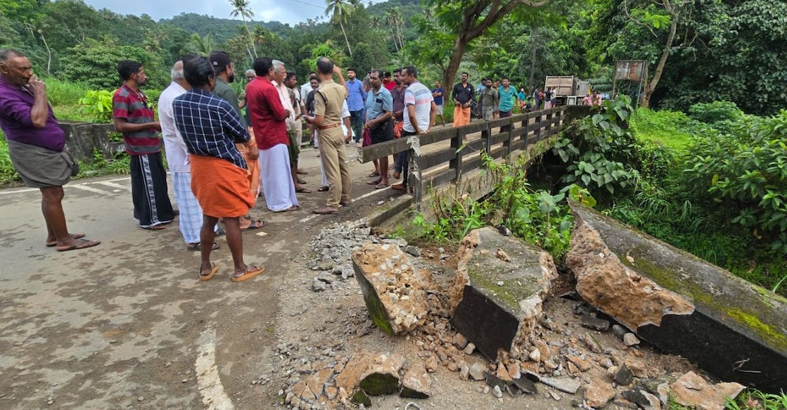 Residents stage a protest on the damaged bridge, blocking quarry lorries over alleged overloading and safety violations. Photo: Special Arrangement