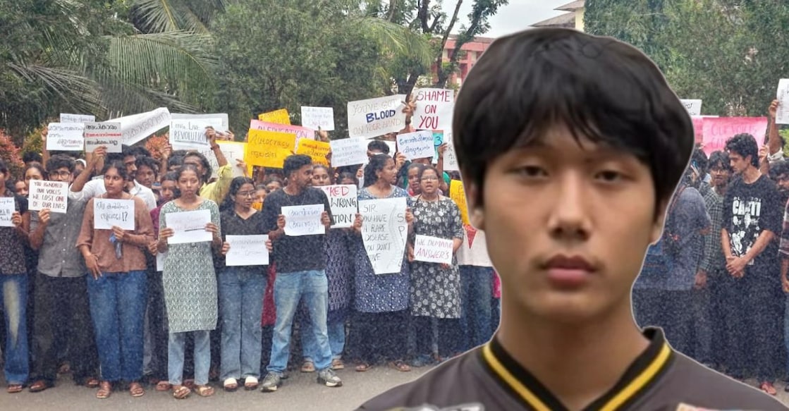Michi Marpu. In the background, students of MA College stage a protest. Photos: Special Arrangement