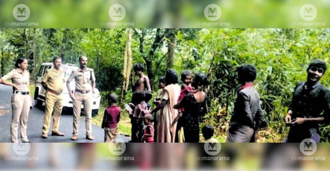 Members of the tribal urunnathi near the Kiliyeranjankallu Forest Check Post at Angamoozhy interact with Moozhiyar SHO A R Ravindran, who visited them to invite them to the Onam feast at the police station. Photo: Special Arrangement.