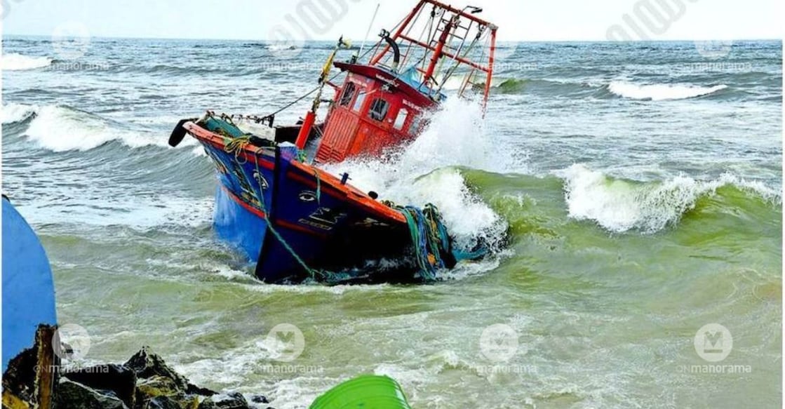 Waves crash into the Kairali fishing boat after it was swept onto the shore at Sakthikulangara. Photo: Special Arrangement.