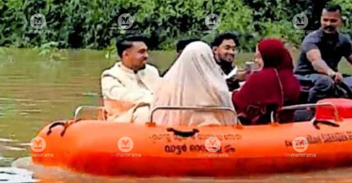 Newlyweds Althafussaman and P P Shamila are taking a boat ride, accompanied by Shabir Pulparamb, 'Ente Mukkam' volunteer, to reach the OSA Auditorium in Mukkam. Image: Special Arrangement