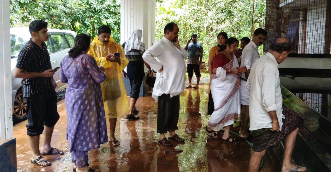 St John's Church Vicar Fr Jose Manikkathazhe, East Eleri panchayat President Mercy Mani and ward members visit a flood-affected house at Palavayal. Photo: Special arrangement