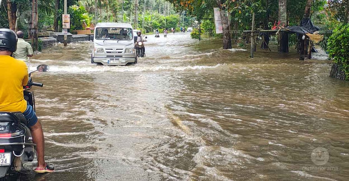 Waterlogged road in Pala near river in Mutholy. Photo: Manorama