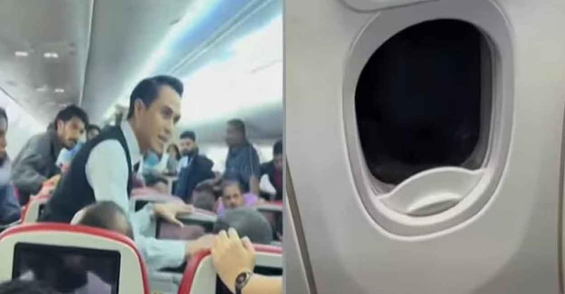 Passenger restrained by cabin crew and fellow passengers. Photo: Facebook/matty.mathew