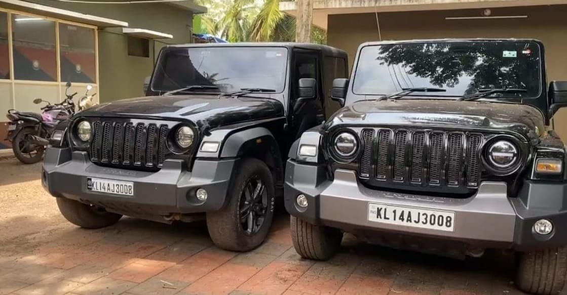 The two black Mahindra SUVs with the same registration number. Photo: Special arrangement