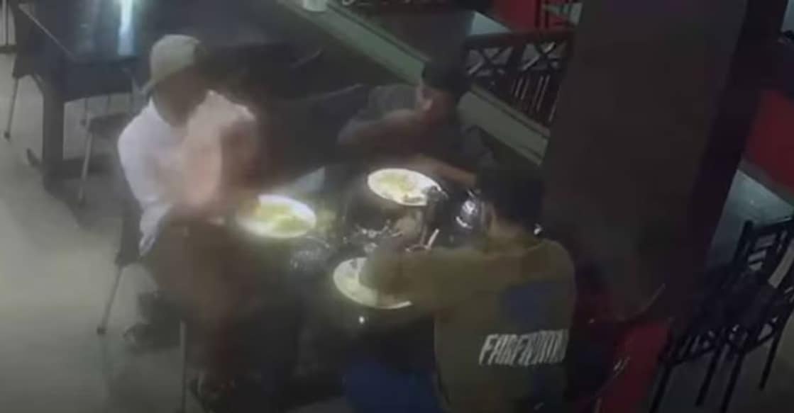 The three men seen having food at a hotel. Photo: CCTV screengrab/Special Arrangement