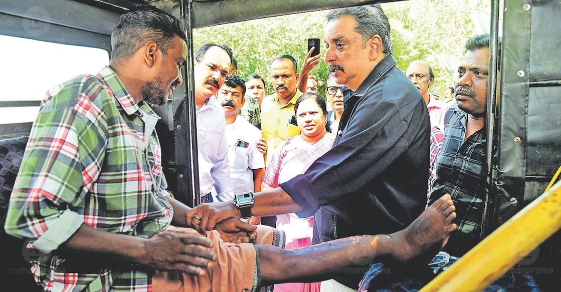 Bairan of Chekadi Polan Ooru in Wayanad, who suffered severe leg injuries in a wild elephant attack, meets Forest Minister Shibu Baby John during the Malayala Manorama seminar in Bathery. Bairan sought assistance for his treatment and a stable source of income. Photo: Dhanesh Ashokan / Manorama.