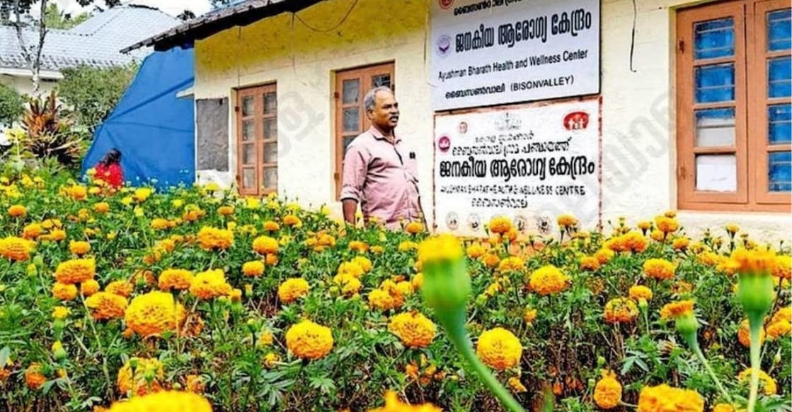 Health Inspector E.A. Baburaj near the marigold garden in the courtyard of the Bisonvalley Community Health Center. Photo: Manorama