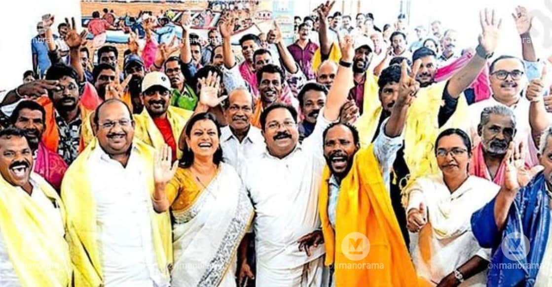 Fishermen share a joyful moment with Minister Bindu Krishna at a felicitation ceremony in Kollam, organized by the Fisheries Department and the State Fisheries Management Council to honor those who participated in the Pathanamthitta flood rescue operations. Photo: Manorama