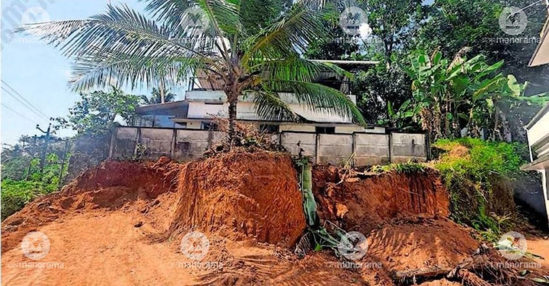 Earth being removed from an adjacent plot, posing a threat to Cherupoyka Thekku Othiramukal Anganwadi No. 77 building. Photo: Special Arrangement.