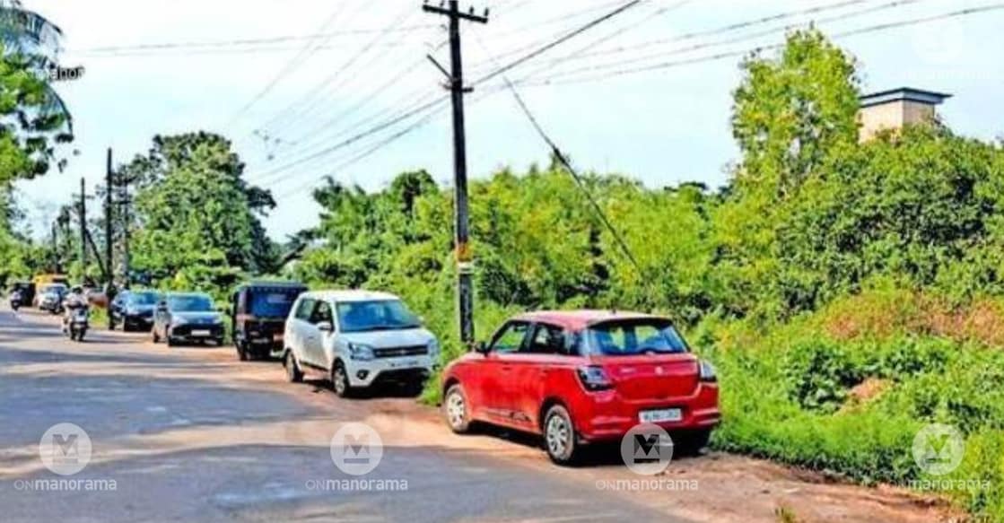 The overgrown Cheruvathur railway station, with vehicles illegally parked along the roadside. Photo: Special Arrangement.