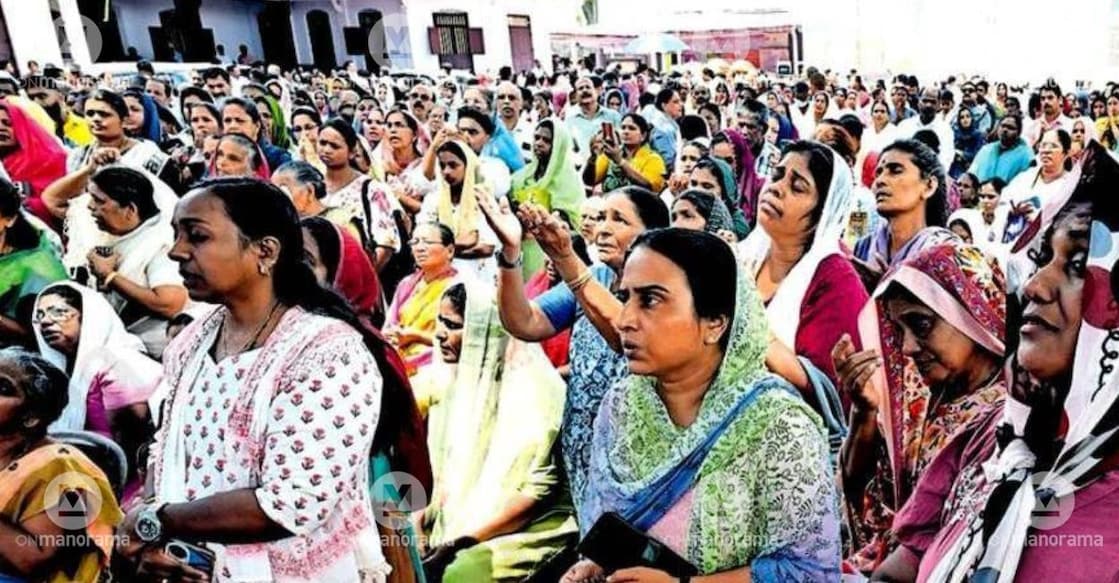 Worshippers watching the ceremonies on a large screen set up in the church courtyard as the sanctuary doors are opened at the Manarcad Marthamariam Jacobite Syriac Cathedral. Photo: Special Arrangement.