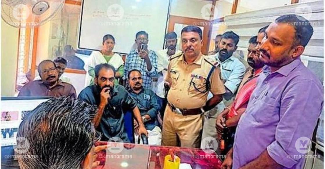 LDF leaders blockade the Pavitreswaram Panchayat Secretary, demanding urgent action over soil removal from a nearby private plot that allegedly threatens the stability of Anganwadi No. 77 at Cherupoyka Thekku Othiramukal. Photo: Special Arrangement.