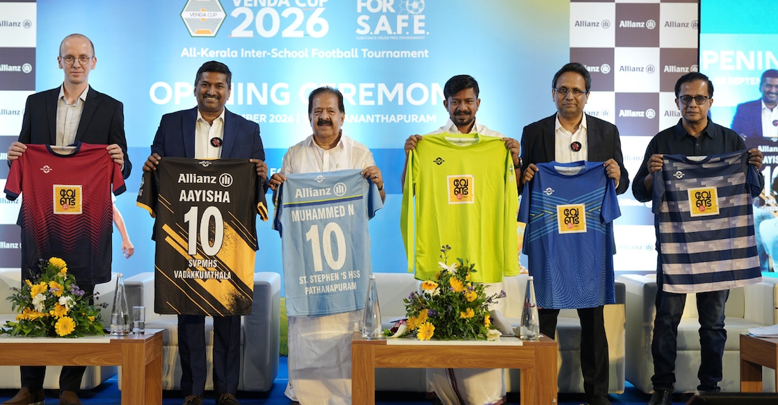 (From left) Hermann Baronius, Global Head of ESG & Sustainability, Allianz Services, Praveen Sasidharan, Chief Services Officer and Board Member, Allianz Services, Ramesh Chennithala, Minister for Home and Vigilance, O J Janeesh, Minister for Sports and Youth Welfare, Jison John, CEO and Managing Director, Allianz Services India, and Swarup B R, Advisory Board Member, Fourth Wave Foundation, holding jerseys during the official unveiling of the jerseys for ‘VENDA Cup’. Photo: Special arrangement