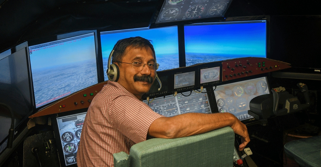 INDIA-CRASH-AIRINDIA-ANXIETY Retired Indian Air Force (IAF) wing commander K Dinesh poses for pictures in a cockpit simulator room, after an interview with Reuters, at Cockpit Vista in Bengaluru, India June 23, 2025. Photo: Meghana Sastry/Reuters