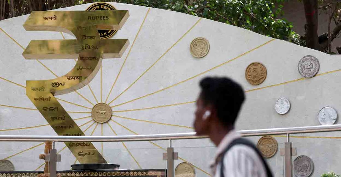 A man walks past an installation of the Rupee logo and Indian currency coins outside the Reserve Bank of India (RBI) headquarters in Mumbai, India, April 9, 2025. File Photo: REUTERS/Francis Mascarenhas