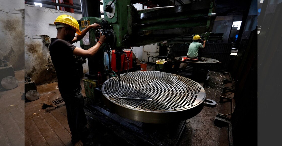 A file photo of a worker making a metal filter plate inside an industrial manufacturing unit on the outskirts of Ahmedabad, India, July 23, 2024. Photo: Reuters