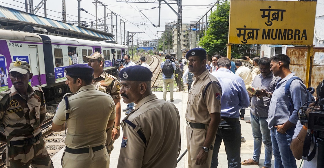 thane local accident Police personnel at the Mumbra Railway Station. Photo: PTI
