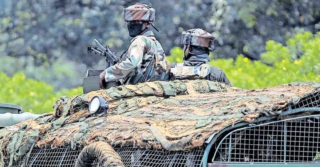 Indian army soldiers patrol on the Jammu-Pathankot highway. File photo: AP/Channi Anand