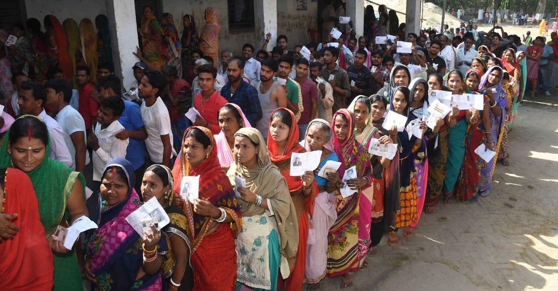 Representative image of people standing in the queue to vote. Photo: IANS