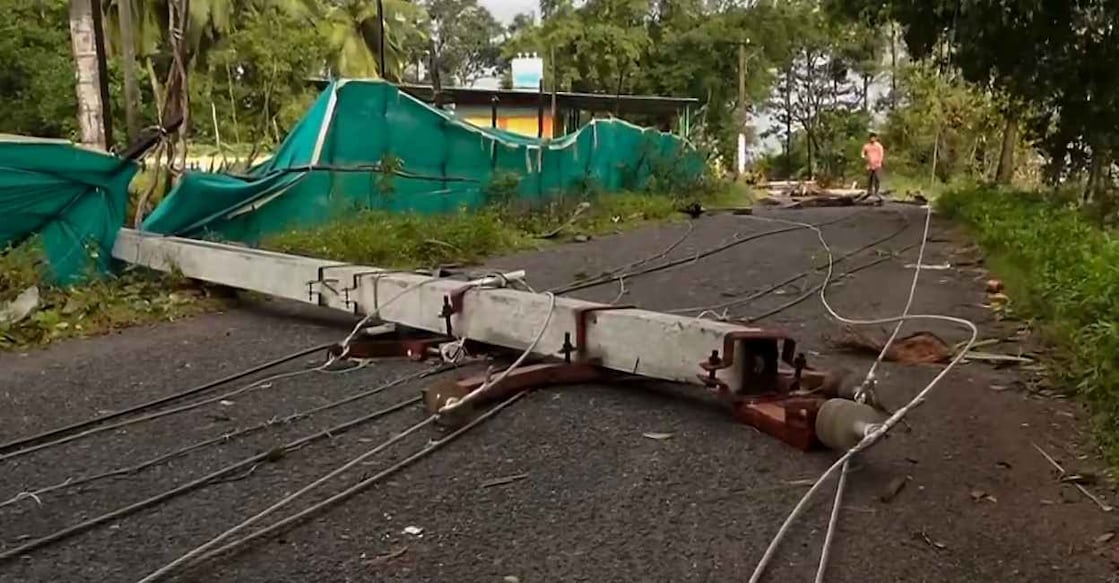 A broken electric pole lies across a road following the destruction caused by Cyclone Montha. Photo: PTI
