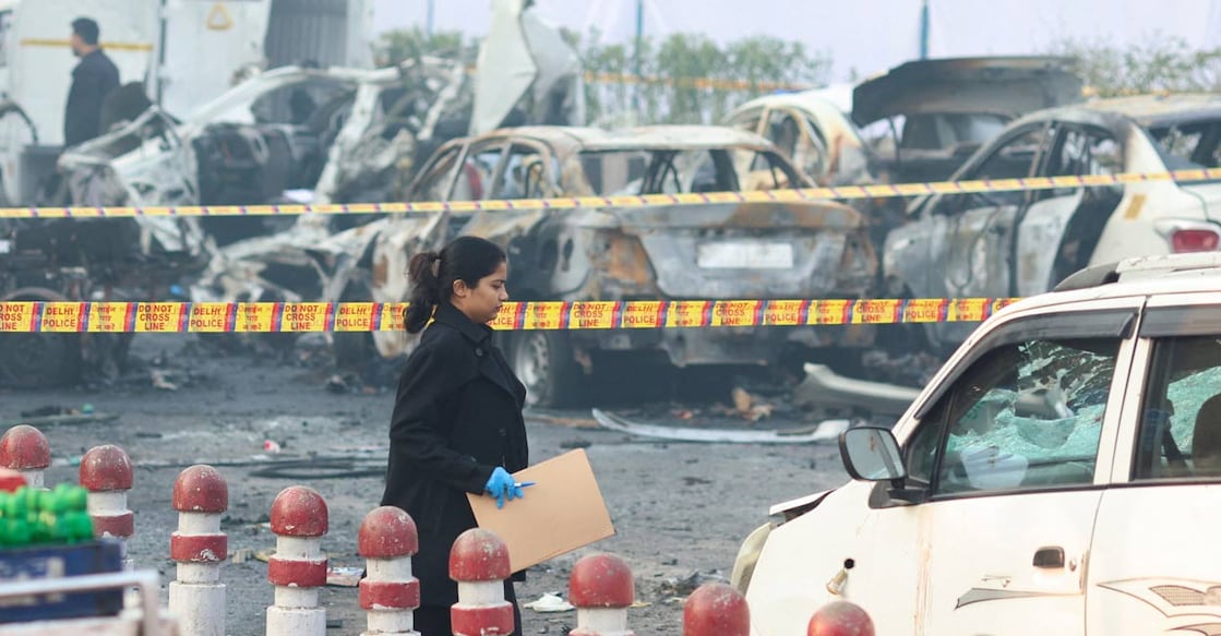 A member of the forensic team works at the site of an explosion near the historic Red Fort in the old quarters of Delhi, India, on November 11. Photo: PTI. 