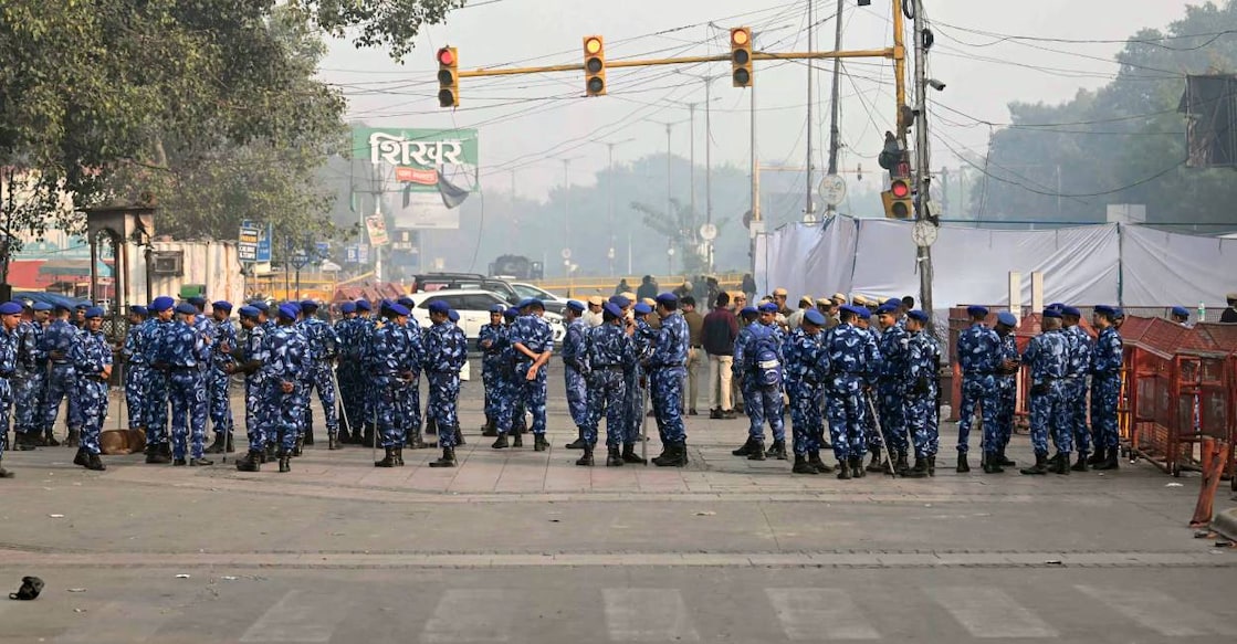 Rapid action force personnel stand guard near the blast site, after an explosion in the Red Fort area in the old quarters of Delhi, on November 12, 2025. Photo: AFP