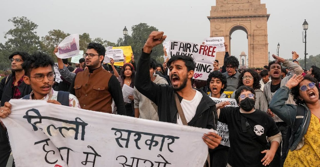 People raise slogans during a protest against worsening air quality in the national capital. Photo: PTI /Karma Bhutia
