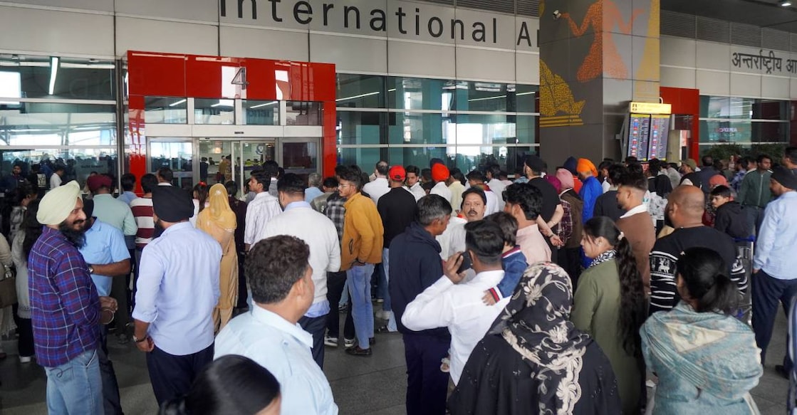 People wait outside the arrivals exit at the Indira Gandhi International (IGI) Airport, in New Delhi on Friday after technical glitch delayed over 800 flights. Photo: PTI
