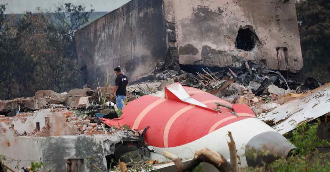 INDIA-CRASH A fire offical stands next to the crashed Air India Boeing 787-8 Dreamliner aircraft, in Ahmedabad, India, June 13, 2025. Photo: REUTERS/Adnan Abidi
