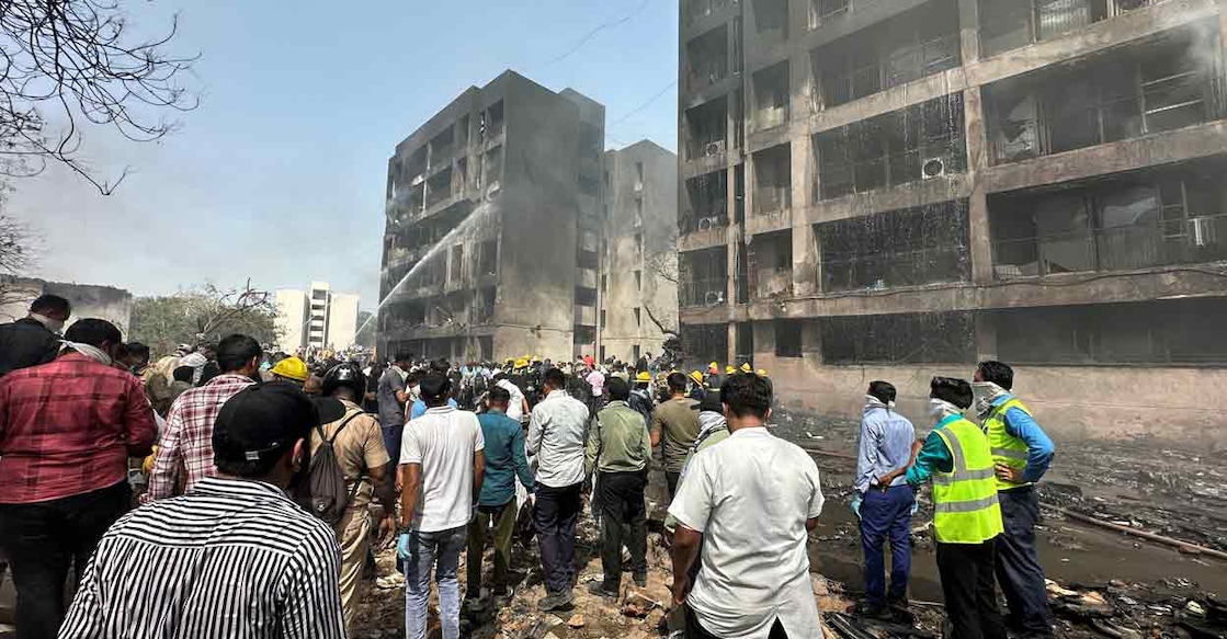 People gather near the site where an Air India plane crashed in Ahmedabad, India, June 12, 2025. Photo: REUTERS/Amit Dave