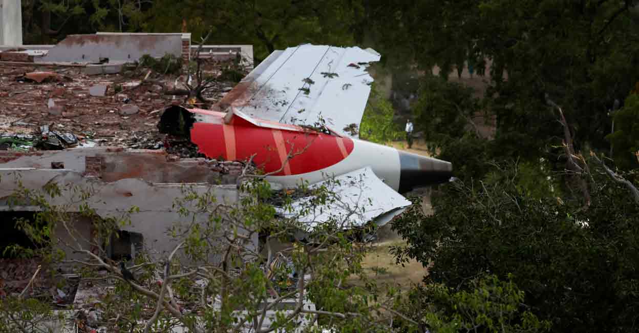 A tail of an Air India Boeing 787 Dreamliner plane that crashed is seen stuck on a building after the incident in Ahmedabad, India, June 12, 2025. Photo: REUTERS/Amit Dave
