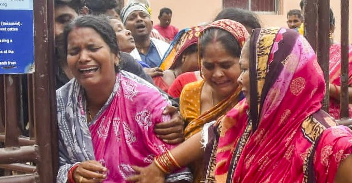 puri-stampede Relatives of the deceased in tears after the stampede at Puri killed three devotees. Photo: PTI
