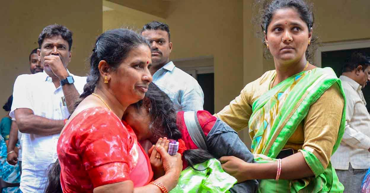 Bengaluru Stampede Family members of Divyanshi, a victim of the stampede near the Chinnaswamy Cricket Stadium, mourn at her residence in Bengaluru. Photo: PTI