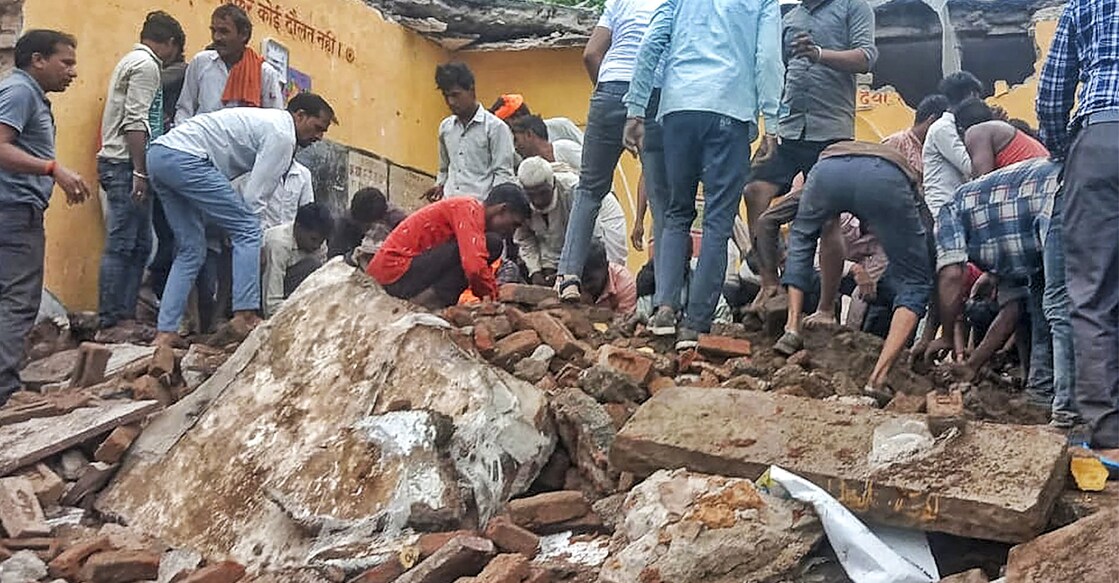 Locals during the rescue work after a government school building collapsed, in Jhalawar district, Rajasthan, Friday, July 25, 2025. Photo: PTI