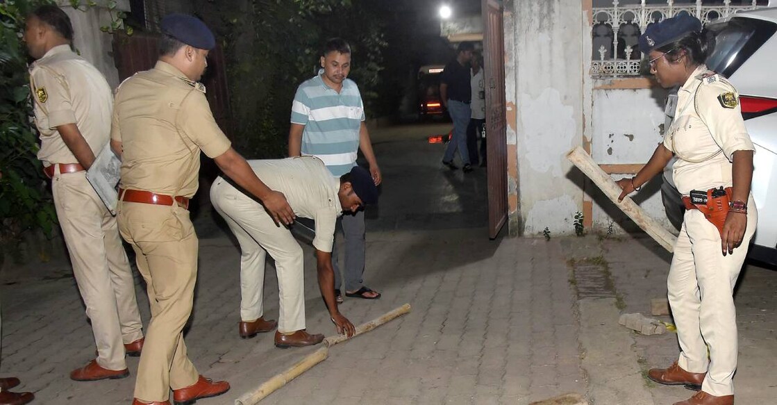 Police personnel during an investigation at an area after businessman Gopal Khemka was allegedly shot dead when he was returning home, in Patna. Photo: PTI