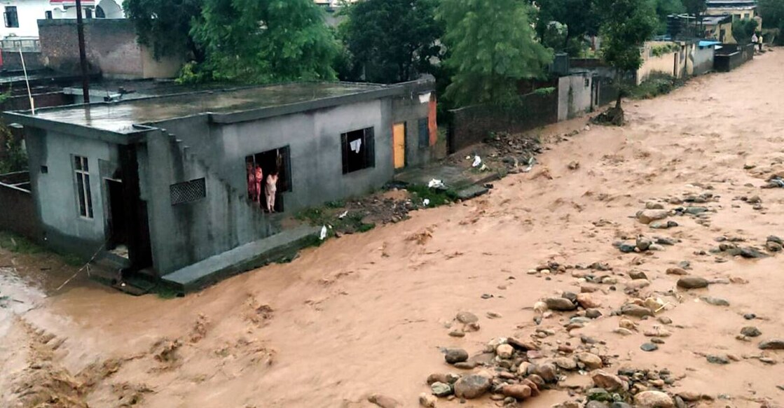 Debris and mud accumulated in a residential area following a cloudburst, in Kathua on Sunday . Photo: PTI