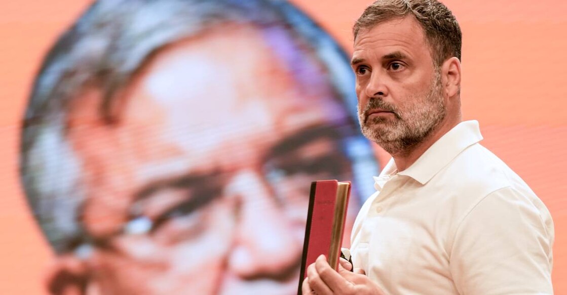 Leader of Opposition in the Lok Sabha and Congress leader Rahul Gandhi holds a copy of 'The Constitution of India' during a press conference, in New Delhi. Photo: PTI